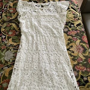 Dress in white cotton lace
